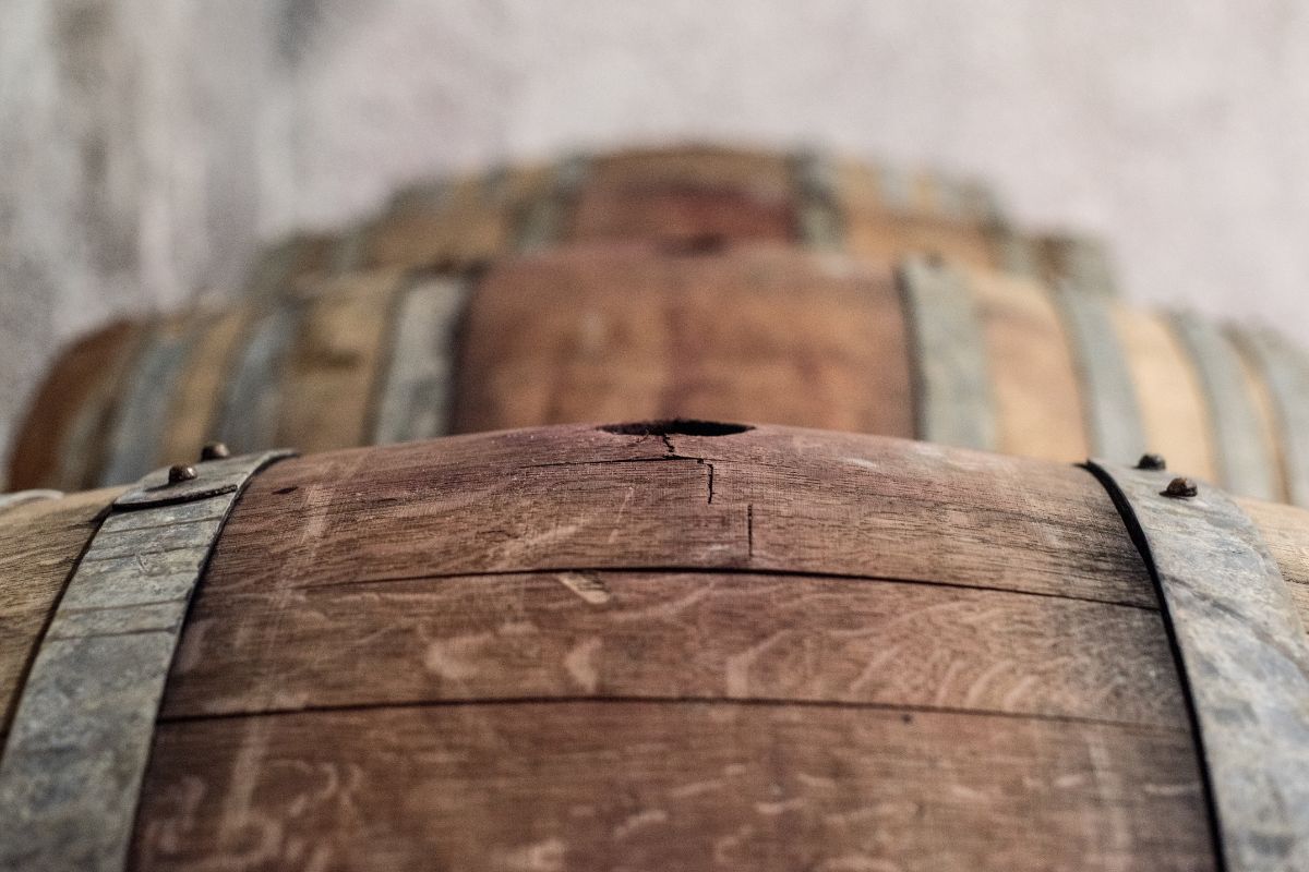 Michael Baldacci stirring wine on its lees with a batonnage rod